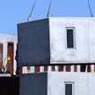 A massive brick structure is being stacked on other bricks.