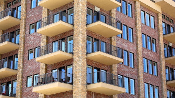 A multi-story building with porches.
