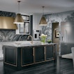 There is a kitchen counter in a gray room with a fridge to the side.