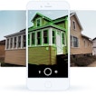 There is a white background with the image of a brown house in front of it. A phone is over the image, with the section having a green outline.